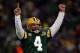 GREEN BAY, WI - JANUARY 20: Quarterback Brett Favre #4 of the Green Bay Packers reacts after a Packers touchdown during the NFC championship game against the New York Giants on January 20, 2008 at Lambeau Field in Green Bay, Wisconsin. The Giants defeate