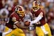 LANDOVER, MD - SEPTEMBER 09: Quarterback Robert Griffin III #10 of the Washington Redskins hands the ball off to running back Alfred Morris #46 before Morris fumbles in the first quarter against the Philadelphia Eagles at FedExField on September 9, 2013