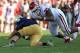 SOUTH BEND, IN - SEPTEMBER 28: Jordan Phillips #80 of the Oklahoma Sooners sacks Tommy Rees #11 of the Notre Dame Fighting Irish at Notre Dame Stadium on September 28, 2013 in South Bend, Indiana. Oklahoma defeated Notre Dame 35-21. (Photo by Jonathan D