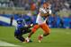 LEXINGTON, KY - SEPTEMBER 28: Trey Burton #8 of the Florida Gators runs with the ball while defended by TraVaughn Paschal #41 of the Kentucky Wildcats during the game at Commonwealth Stadium on September 28, 2013 in Lexington, Kentucky. (Photo by Andy L