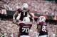 Sep 14, 2013; College Station, TX, USA; Texas A&M Aggies running back Ben Malena (1) celebrates rushing for a touchdown with offensive linesman Cedric Ogbuehi (70) against the Alabama Crimson Tide during the first half at Kyle Field. Mandatory Credit: Tho