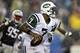 Sep 12, 2013; Foxborough, MA, USA; New York Jets quarterback Geno Smith (7) rolls out of the pocket during the fourth quarter against the New England Patriots at Gillette Stadium. The New England Patriots won 13-10. Mandatory Credit: Greg M. Cooper-USA T