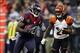 Jan 5, 2013; Houston, TX, USA; Houston Texans wide receiver Andre Johnson (80) is pursued by Cincinnati Bengals cornerback Adam Jones (24) after a catch during the third quarter of the AFC Wild Card playoff game at Reliant Stadium. The Texans defeated the