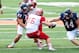 Sep 28, 2013; Champaign, IL, USA; Miami (Oh) Redhawks quarterback Austin Boucher (16) tries to avoid a tackle by Illinois Fighting Illini linebacker Mason Monheim (43) and Illinois Fighting Illini defensive lineman Austin Teitsma (44) during the second qu