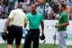 LAKE FOREST, IL - SEPTEMBER 12: Tiger Woods (C) shakes hands with Steve Williams (L) as Adam Scott of Australia looks on during the First Round of the BMW Championship at Conway Farms Golf Club on September 12, 2013 in Lake Forest, Illinois. (Photo by Mi