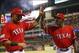 Jul 6, 2013; Arlington, TX, USA; Texas Rangers right fielder Nelson Cruz (17) is congratulated by manager Ron Washington (38) for his solo home run against the Houston Astros during the seventh inning at the Rangers Ballpark in Arlington. Mandatory Credit