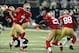 Sep 26, 2013; St. Louis, MO, USA; San Francisco 49ers quarterback Colin Kaepernick (7) hands off to running back Frank Gore (21) for a 34 yard touchdown during the first half against the St. Louis Rams at the Edward Jones Dome. San Francisco defeated St.