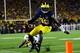 Sep 7, 2013; Ann Arbor, MI, USA; Michigan Wolverines quarterback Devin Gardner (98) scrambles out of the pocket getting away from Notre Dame Fighting Irish safety Matthias Farley (41) during the fourth quarter at Michigan Stadium. Mandatory Credit: Andrew