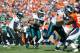 DENVER, CO - SEPTEMBER 29: running back Chris Polk #32 of the Philadelphia Eagles takes a handoff for a touchdown from Michael Vick #7 in the first half at Sports Authority Field Field at Mile High on September 29, 2013 in Denver, Colorado. (Photo by Du