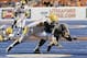 Sep 28, 2013; Boise, ID, USA; Boise State Broncos quarterback Grant Hedrick (9) is brought down by Southern Miss Golden Eagles defensive lineman Khyri Thornton (98) as Hedrick runs for a first down during the second half against the Southern Miss Golden E