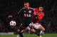 MANCHESTER, ENGLAND - SEPTEMBER 17: Shinji Kagawa of Manchester United competes with Sidney Sam of Bayer Leverkusen during the UEFA Champions League Group A match between Manchester United and Bayer Leverkusen at Old Trafford on September 17, 2013 in Man