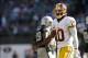 Sep 29, 2013; Oakland, CA, USA; Washington Redskins quarterback Robert Griffin III (10) walks on the field during a break in the action against the Oakland Raiders in the fourth quarter at O.co Coliseum. The Redskins defeated the Raiders 24-14. Mandatory