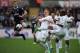 SWANSEA, WALES - MARCH 30: Lewis Holtby of Spurs wins the ball from Garry Monk, Ashley Williams and Dwight Tiendalli of Swansea during the Barclays Premier League match between Swansea City and Tottenham Hotspur at Liberty Stadium on March 30, 2013 in Sw