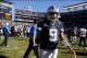 Sep 29, 2013; San Diego, CA, USA; Dallas Cowboys quarterback Tony Romo (9) walks off the field after at the end of a 30-21 loss to the San Diego Chargers at Qualcomm Stadium. Mandatory Credit: Robert Hanashiro-USA TODAY Sports