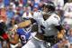 Sep 29, 2013; Orchard Park, NY, USA; Baltimore Ravens quarterback Joe Flacco (5) gets hit by Buffalo Bills defensive tackle Alan Branch (90) after a throw during the first half at Ralph Wilson Stadium. Mandatory Credit: Timothy T. Ludwig-USA TODAY Sports