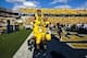 Sep 28, 2013; Morgantown, WV, USA; West Virginia Mountaineers quarterback Clint Trickett (9) and offensive linesman Curtis Feigt (62) celebrate after beating the Oklahoma State Cowboys at Milan Puskar Stadium. Mandatory Credit: Peter Casey-USA TODAY Sport