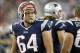 Aug 16, 2013; Foxborough, MA, USA; New England Patriots defensive tackle Joe Vellano (64) on the sideline during the third quarter against the Tampa Bay Buccaneers at Gillette Stadium. The New England Patriots won 25-21. Mandatory Credit: Greg M. Cooper