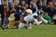 SOUTH BEND, IN - SEPTEMBER 21: Louis Nix III #1 of the Notre Dame Fighting Irish sacks Andrew Maxwell #10 of the Michigan State Spartans at Notre Dame Stadium on September 21, 2013 in South Bend, Indiana. Notre Dame defeated Michigan State 17-13. (Photo b