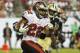 TAMPA, FL - SEPTEMBER 15: Running back Doug Martin #22 of the Tampa Bay Buccaneers rushes upfield in the 4th quarter against the New Orleans Saints September 15, 2013 at Raymond James Stadium in Tampa, Florida. The Saints won 16 - 14. (Photo by Al Mess