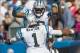 Sep 22, 2013; Charlotte, NC, USA; Carolina Panthers wide receiver Ted Ginn (19) celebrates with quarterback Cam Newton (1) after scoring a touchdown during the fourth quarter at Bank of America Stadium. The Panthers defeated the Giants 38-0. Mandatory Cr