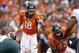 Sep 29, 2013; Denver, CO, USA; Denver Broncos quarterback Peyton Manning (18) signals at the line of scrimmage during the second half against the Philadelphia Eagles at Sports Authority Field at Mile High. Mandatory Credit: Chris Humphreys-USA TODAY Sport