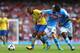 LONDON, ENGLAND - AUGUST 03: Theo Walcott of Arsenal battles for the ball with Valon Behrami of Napoli during the match between Arsenal and Napoli at Emirates Stadium on August 3, 2013 in London, England. (Photo by Paul Gilham/Getty Images)
