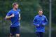 ST ALBANS, ENGLAND - SEPTEMBER 30: Mesut Oezil and Per Mertesacker of Arsenal warm up during an Arsenal training session ahead of their Champions League Group F match against Napoli at London Colney on September 30, 2013 in St Albans, England. (Photo by