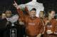 PASADENA, CA - JANUARY 04: Head coach Mack Brown of the Texas Longhorns celebrates with the National Championship trophy after defeating the USC Trojans 41-38 to win the BCS National Championship Rose Bowl Game on January 4, 2006 in Pasadena, California.