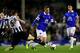 LIVERPOOL, ENGLAND - SEPTEMBER 30: Ross Barkley of Everton in action against Mike Williamson of Newcastle during the Barclays Premier League match between Everton and Newcastle United at Goodison Park on September 30, 2013 in Liverpool, England. (Photo