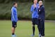ST ALBANS, ENGLAND - SEPTEMBER 17: Arsene Wenger of Arsenal looks on with Per Mertesacker and Mesut Ozil during an Arsenal training session at London Colney on September 17, 2013 in St Albans, England. (Photo by Jamie McDonald/Getty Images)