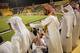 DOHA, QATAR - OCTOBER 23: Fans wearing traditional local dress react to play during the Gharafa vs. Kharaitiyat Qatar Stars League football match at Al Gharafa Stadium on October 23, 2011 in Doha, Qatar. Qatar will host the 2022 FIFA World Cup football c