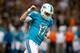 NEW ORLEANS, LA - SEPTEMBER 30: Quarterback Ryan Tannehill #17 of the Miami Dolphins celebrates after running back Lamar Miller #26 scores on a five-yard touchdown run in the second quarter against the New Orleans Saints at the Mercedes-Benz Superdome on