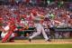 ST. LOUIS, MO - AUGUST 28: Ryan Ludwick #48 of the Cincinnati Reds hits a two-RBI double against the St. Louis Cardinals to score Joey Votto #19 and Jay Bruce #32 in the first inning at Busch Stadium on August 28, 2013 in St. Louis, Missouri. (Photo by