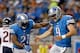 DETROIT, MI - SEPTEMBER 29: Reggie Bush #21 and Matthew Stafford #9 of the Detroit Lions celebrate a touchdown against the Chicago Bears at Ford Field on September 29, 2013 in Detroit, Michigan. (Photo by Gregory Shamus/Getty Images)