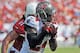 TAMPA, FL - SEPTEMBER 29: Cornerback Darrelle Revis #24 of the Tampa Bay Buccaneers intercepts a pass in the 3rd quarter against the Arizona Cardinals September 29, 2013 at Raymond James Stadium in Tampa, Florida. Arizona won 13 - 10. (Photo by Al Messe