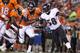 DENVER, CO - SEPTEMBER 05: Elvis Dumervil #58 beats the block of Julius Thomas #80 of the Denver Broncos during the NFL season opener at Sports Authority Field at Mile High on September 5, 2013 in Denver, Colorado. The Broncos defeated the Ravens 49-27.