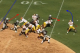 The blocking breaks down and the Raiders begin to force Griffin to the sideline.