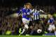 LIVERPOOL, ENGLAND - SEPTEMBER 30: Everton player Ross Barkley shoots past Mapou Yanga-Mbiiwa to score the second goal during the Barclays Premier League match between Everton and Newcastle United at Goodison Park on September 30, 2013 in Liverpool, Engl