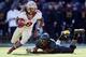 COLLEGE PARK, MD - NOVEMBER 17: Running back Devonta Freeman #8 of the Florida State Seminoles eludes the tackle of linebacker Kenneth Tate #6 of the Maryland Terrapins during the first half at Byrd Stadium on November 17, 2012 in College Park, Maryland.