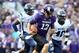 Sep 21, 2013; Evanston, IL, USA; Northwestern Wildcats quarterback Trevor Siemian (13) runs away from Maine Black Bears defensive lineman Jonathan Lewis (91) and linebacker Christophe Mulumba (40) during the second quarter at Ryan Field. Mandatory Credit