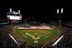 DETROIT, MI - OCTOBER 16: A giant American flag is spread across the field as players from the Detroit Tigers and the New York Yankees line up on the baseline during the performance of the National Anthem prior to game three of the American League Champi