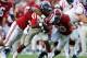 TUSCALOOSA, AL - SEPTEMBER 28: Jeff Scott #3 of the Mississippi Rebels rushes against Trey DePriest #33 and Jarrick Williams #20 of the Alabama Crimson Tide at Bryant-Denny Stadium on September 28, 2013 in Tuscaloosa, Alabama. (Photo by Kevin C. Cox/Get