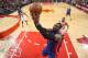 CHICAGO, IL - MARCH 31: Andre Drummond #1 of the Detroit Pistons goes to the basket past Daequan Cook #14 of the Chicago Bulls on March 31, 2013 at the United Center in Chicago, Illinois. NOTE TO USER: User expressly acknowledges and agrees that, by downl