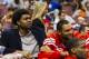 Oct 17, 2012; Philadelphia, PA, USA; Philadelphia 76ers center Andrew Bynum (33) (in street cloths) sits next to center Dan Gadzuric (14) at the end of the bench during the third quarter against the Cleveland Cavaliers at the Wachovia Center. The Sixers d