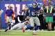 Sep 15, 2013; East Rutherford, NJ, USA; New York Giants tight end Brandon Myers (83) carries the ball against Denver Broncos linebacker Danny Trevathan (59) during the second quarter of a game at MetLife Stadium. Mandatory Credit: Brad Penner-USA TODAY Sp