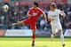 SWANSEA, WALES - APRIL 20: Maya Yoshida (L) of Southampton clears from Michu (R) of Swansea City during the Barclays Premier League match between Swansea City and Southampton at the Liberty Stadium on April 20, 2013 in Swansea, Wales. (Photo by Michael St