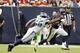 HOUSTON, TX - SEPTEMBER 29: Arian Foster #23 of the Houston Texans avoids being tackled by Cliff Avril #56 of the Seattle Seahawks in the fourth quarter at Reliant Stadium on September 29, 2013 in Houston, Texas. (Photo by Bob Levey/Getty Images)