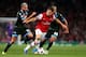 LONDON, ENGLAND - OCTOBER 01: Aaron Ramsey of Arsenal is pursued by Valon Behrami (L) and Gokhan Inler (R) of Napoli during UEFA Champions League Group F match between Arsenal FC and SSC Napoli at Emirates Stadium on October 1, 2013 in London, England.