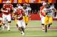 LINCOLN, NE - NOVEMBER 17: Running back Ameer Abdullah #8 of the Nebraska Cornhuskers tries to power throughout the grip of defensive back Michael Carter #23 of the Minnesota Golden Gophers during their game at Memorial Stadium on November 17, 2012 in Lin