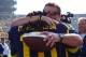 November 17, 2012; Ann Arbor, MI, USA; Michigan Wolverines head coach Brady Hoke hugs Michigan Wolverines quarterback Denard Robinson (16) before the game against the Iowa Hawkeyes at Michigan Stadium. Mandatory Credit: Rick Osentoski-USA TODAY Sports